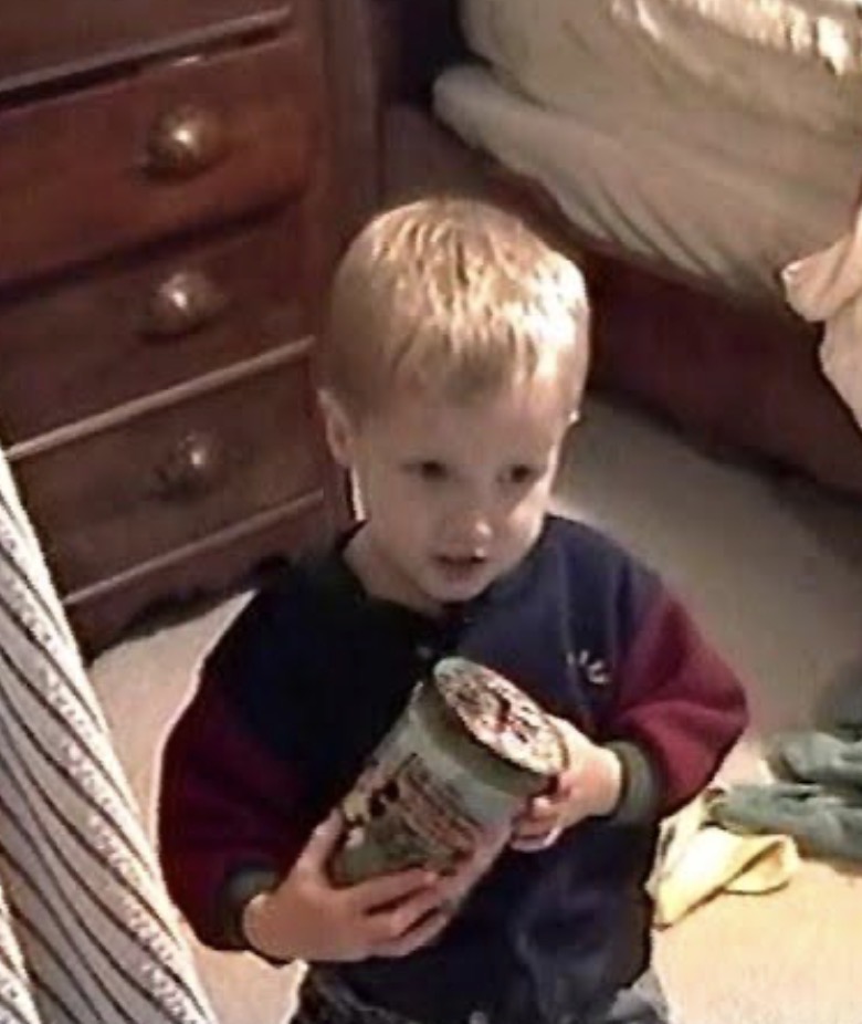 Sean Lundberg as a young child holding a pint of ice cream